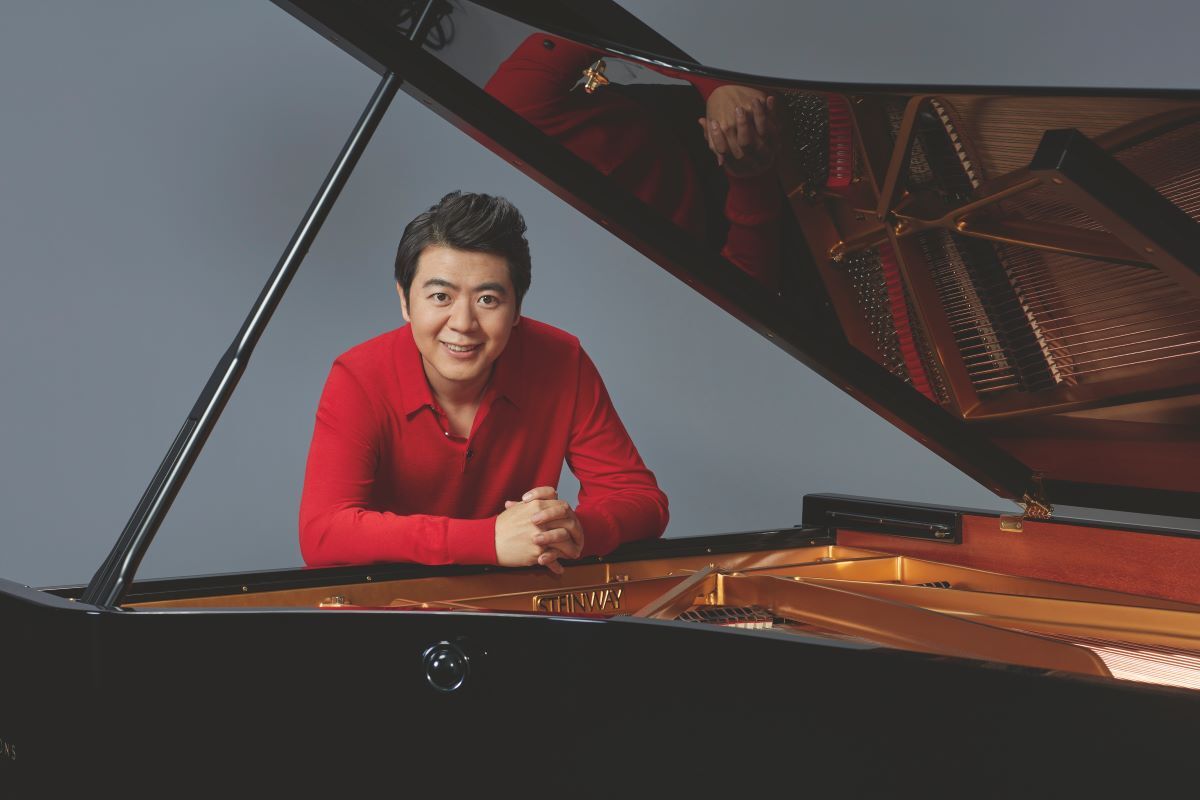 Lang Lang posing under a Steinway grand piano to relieve Disney classic songs at Etihad Arena this winter