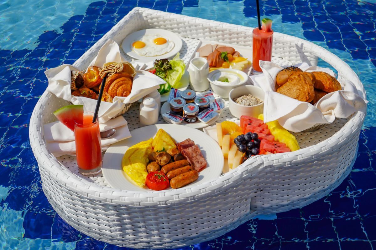 Royal M Hotel by Gewan Abu Dhabi floating breakfast tray Royal M Hotel by Gewan Abu Dhabi floating breakfast tray that includes a watermelon juice, full english breakfast with an omelette, eggs, croissants, patries, fruit platter and more for the best breafkast offers in Abu Dhabi