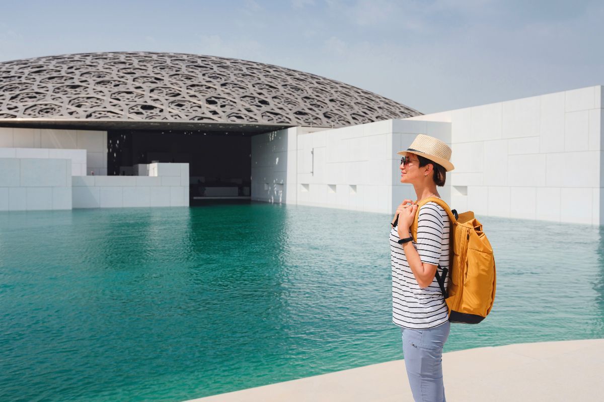 Things to do in Abu Dhabi this weekend A tourist in front of Louvre Abu Dhabi for the best things to do this weekend in Abu Dhabi