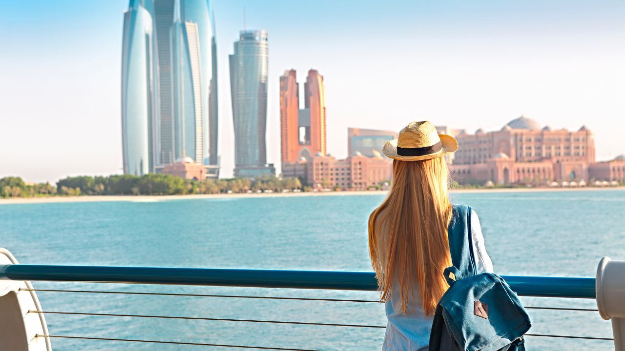 abu dhabi city girl in corniche looking at the view in front of her abu dhabi city