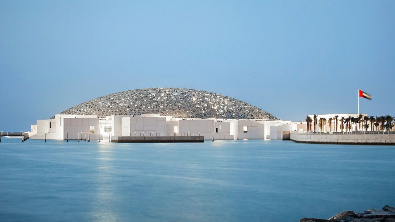 louvre exterior image by the sea with flag