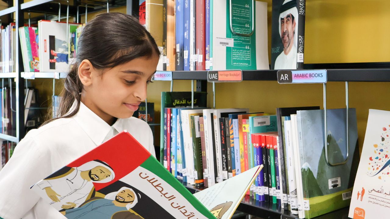 raha international school khalifa city campus student reading in the library