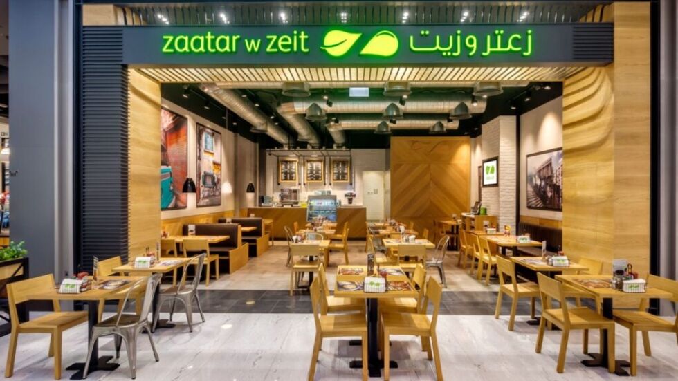 a restaurant with tables and chairs Zaatar w Zeit