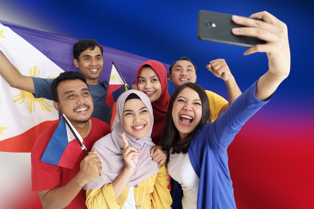 Filipinos Filipinos taking a selfie with the Philippine flag